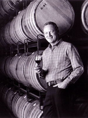 Peterson poses in front of barrels on Peterson Pallets in 1981 at The Monterey Vineyard.